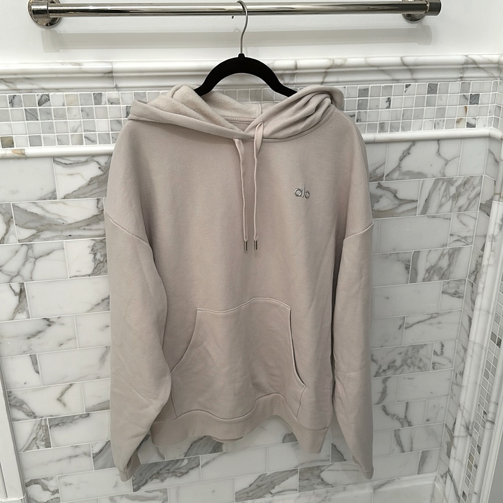 Alo yoga beige hoodie with silver metallic logo. Size medium.